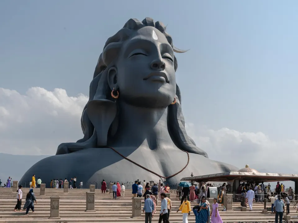 The Adiyogi statue near Coimbatore, Tamil Nadu, with visitors under a blue sky