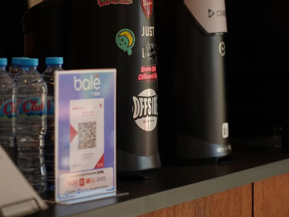 QR code stand on a shop counter, a simple way for Coimbatore customers to reach a business online