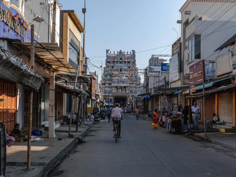 Busy Tamil Nadu shopping street with local shop signboards, like the Coimbatore areas covered by local SEO